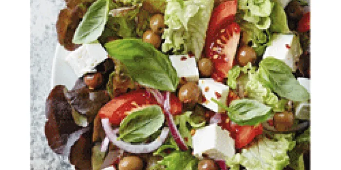 Salad with lettuce, tomatoes, olives and cheese